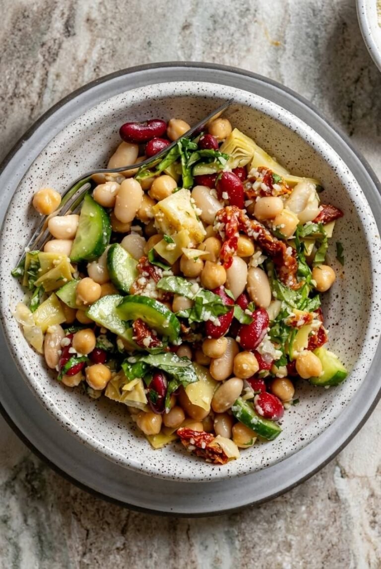 high protein 3 bean salad recipe - high protein 3 bean salad served in a white bowl overhead view