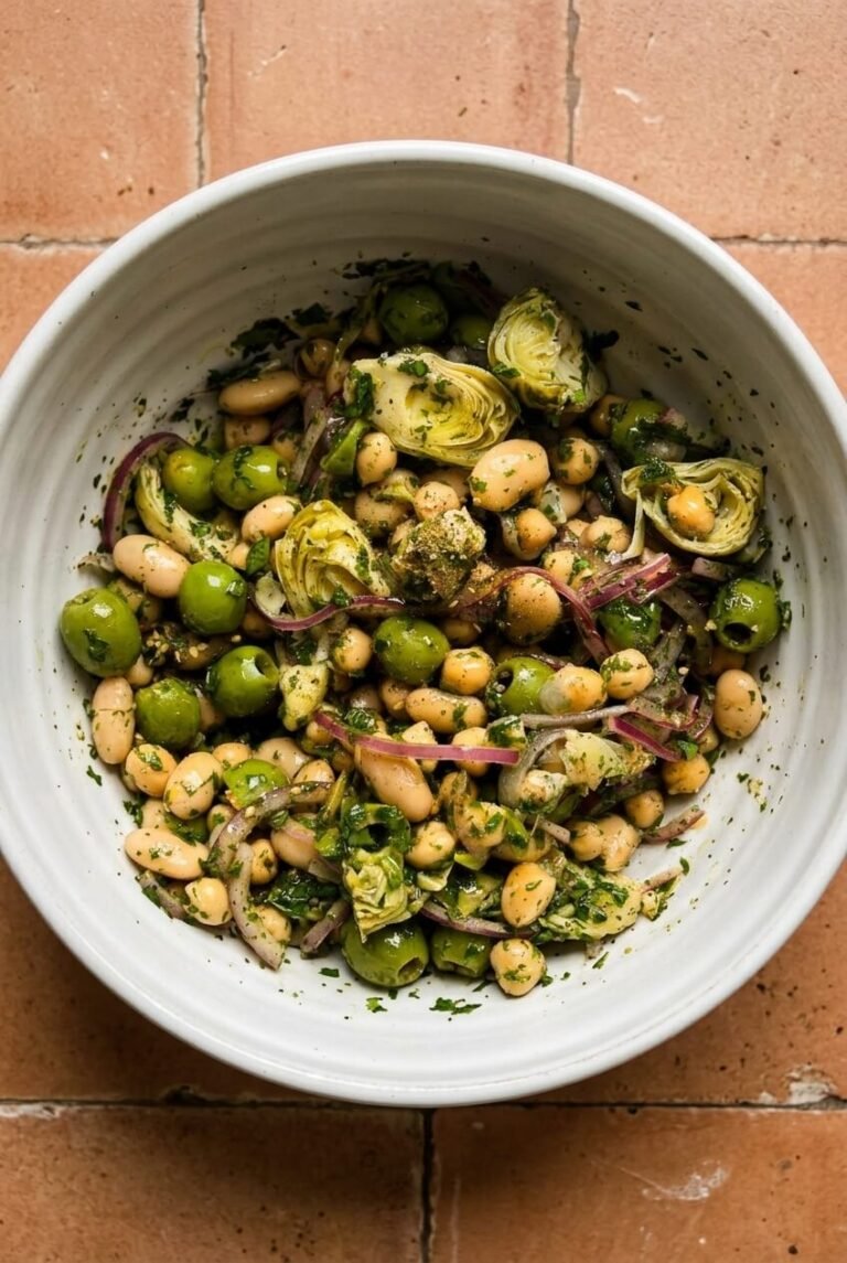 marinated za’atar bean salad recipe - Marinated Za’atar Bean Salad served in a white bowl overhead view