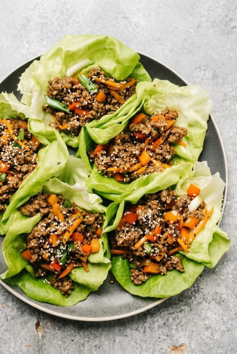 beef lettuce wraps recipe - beef lettuce wraps served in a white bowl overhead view
